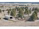 Sprawling property with a home, large storage structure, mature trees and a beautiful landscape in a serene, rural setting at 2287 Pinto Trl, Elizabeth, CO 80107
