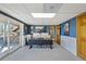 Well-lit office with large sliding glass doors leading to a patio, and a modern two-monitor workstation at 2287 Pinto Trl, Elizabeth, CO 80107