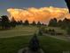 Picturesque view from the home overlooking the expansive backyard and captivating golden sky at 2287 Pinto Trl, Elizabeth, CO 80107