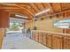 View of the workshop interior with a workbench and built-in drawers, with a garage door leading outside at 2287 Pinto Trl, Elizabeth, CO 80107