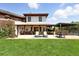 Charming back patio with comfortable seating and ample space for outdoor dining, ideal for relaxation and entertainment at 3720 Ranch Hand Ln, Castle Rock, CO 80104