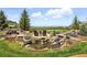 Serene backyard featuring a rock water feature with a seating area and mountain views at 3720 Ranch Hand Ln, Castle Rock, CO 80104
