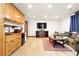 Finished basement featuring a kitchenette, tv, and living area at 3720 Ranch Hand Ln, Castle Rock, CO 80104