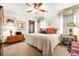 Cozy bedroom with patterned curtains, southwestern style textiles, and wood furnishings at 3720 Ranch Hand Ln, Castle Rock, CO 80104