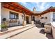 Beautiful courtyard with brick pavers, an outdoor grill, and seating, creating a perfect space for entertaining and enjoying the outdoors at 3720 Ranch Hand Ln, Castle Rock, CO 80104