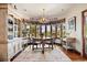 Charming dining area with large windows offering beautiful views, perfect for gatherings at 3720 Ranch Hand Ln, Castle Rock, CO 80104