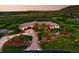 Stunning home featuring beautiful landscaping, a circular driveway, and picturesque hillside views at 3720 Ranch Hand Ln, Castle Rock, CO 80104
