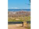 A neighborhood street with an outdoor lamp and a snow-capped mountain range in the background at 3720 Ranch Hand Ln, Castle Rock, CO 80104