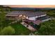 Beautiful home featuring a large lawn, an expansive covered patio and several entertaining areas at 3720 Ranch Hand Ln, Castle Rock, CO 80104