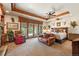 Serene bedroom featuring an exterior seating area, natural light, and wood beam details at 3720 Ranch Hand Ln, Castle Rock, CO 80104