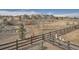 An open view of a backyard featuring a fence and some houses in the distance at 23709 E Caleb Pl, Aurora, CO 80016