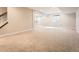 Spacious basement with neutral carpeting and natural light from windows at 23709 E Caleb Pl, Aurora, CO 80016