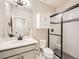 Bright bathroom featuring a vanity with white countertop and a modern glass-enclosed shower at 23709 E Caleb Pl, Aurora, CO 80016