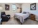 Cozy bedroom featuring natural light, a comfortable armchair, and unique decor at 23709 E Caleb Pl, Aurora, CO 80016