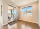 Bright dining area with sliding glass doors to patio and large windows providing natural light at 23709 E Caleb Pl, Aurora, CO 80016