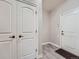 Hallway with tile floor and white doors at 23709 E Caleb Pl, Aurora, CO 80016