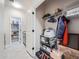 Hallway view with storage and pantry featuring convenient access and shelving at 23709 E Caleb Pl, Aurora, CO 80016