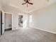 Spacious main bedroom featuring a tray ceiling, ceiling fan and access to a luxurious bathroom at 23709 E Caleb Pl, Aurora, CO 80016