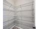 Well-organized walk-in pantry with ample wire shelving for optimal storage at 23709 E Caleb Pl, Aurora, CO 80016