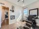 Bright and airy room featuring hardwood floors, a window and black leather barber's chair at 23709 E Caleb Pl, Aurora, CO 80016