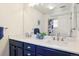 Elegant bathroom with a double vanity, marble countertop, and modern fixtures at 18669 Stroh Rd # 10208, Parker, CO 80134