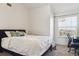 Comfortable bedroom with a large bed and plenty of natural light at 18669 Stroh Rd # 10208, Parker, CO 80134