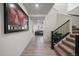 View of the entryway with a modern staircase and large artwork at 1161 E Witherspoon Dr, Elizabeth, CO 80107