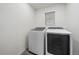 Bright laundry room with washer and dryer at 1161 E Witherspoon Dr, Elizabeth, CO 80107
