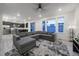 Open concept living room with kitchen views and large sectional sofa at 1161 E Witherspoon Dr, Elizabeth, CO 80107