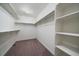 Large walk-in closet with shelves and hanging rods at 1161 E Witherspoon Dr, Elizabeth, CO 80107