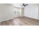 Bedroom features a ceiling fan, sliding-door closet and a large window at 2716 E Otero Pl # 6, Centennial, CO 80122