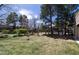 Gated pool area with picnic tables, grills, and lush green grass at 2716 E Otero Pl # 6, Centennial, CO 80122