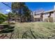 View of community pool, picnic tables, and grill in fenced in area with townhomes in background at 2716 E Otero Pl # 6, Centennial, CO 80122