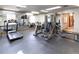 Community gym with treadmills, stationary bikes, universal machine, and mirrors at 2716 E Otero Pl # 6, Centennial, CO 80122