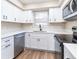 Updated kitchen features white cabinets, quartz countertops, and stainless steel appliances at 2716 E Otero Pl # 6, Centennial, CO 80122