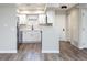 Renovated kitchen with white cabinets, stainless steel appliances, and wood-look floors at 2716 E Otero Pl # 6, Centennial, CO 80122