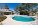 A sparkling community pool with ample deck space surrounded by mature trees and landscaping at 2716 E Otero Pl # 6, Centennial, CO 80122