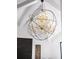 Close-up of a spherical chandelier with crystal accents and metal framework at 49 Charlou Cir, Cherry Hills Village, CO 80111