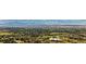 Distant aerial view of a large area with homes, farms and distant mountains at 49 Charlou Cir, Cherry Hills Village, CO 80111