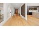 Open-concept hallway showcases the home's architectural design, hardwood floors and natural light at 49 Charlou Cir, Cherry Hills Village, CO 80111