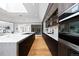 Gourmet kitchen featuring a large island, custom cabinets, state-of-the-art appliances and a skylight at 49 Charlou Cir, Cherry Hills Village, CO 80111