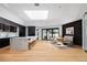 This spacious kitchen is filled with light from the skylight and features bar seating and a dining area at 49 Charlou Cir, Cherry Hills Village, CO 80111