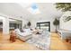 Cozy living area featuring a plush sectional sofa, modern fireplace, and stylish decor at 49 Charlou Cir, Cherry Hills Village, CO 80111
