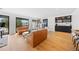 Bright living room with large windows, comfortable seating, and a modern aesthetic at 49 Charlou Cir, Cherry Hills Village, CO 80111