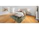 Serene main bedroom featuring wood floors, a cozy rug, and calming decor at 49 Charlou Cir, Cherry Hills Village, CO 80111