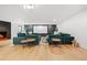 Comfortable home theater with plush seating, a large screen, and a cozy fireplace at 49 Charlou Cir, Cherry Hills Village, CO 80111