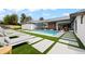 Backyard swimming pool with lounge chairs and manicured lawn, ideal for relaxation and entertaining at 49 Charlou Cir, Cherry Hills Village, CO 80111