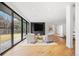 Modern sitting area with large windows, stylish seating, and elegant design at 49 Charlou Cir, Cherry Hills Village, CO 80111