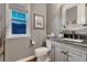 Charming bathroom with rustic vanity, neutral paint, and attractive mirror at 5478 Water Oak Cir, Castle Rock, CO 80108