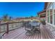 Back deck features a dining area with neighborhood and mountain views at 5478 Water Oak Cir, Castle Rock, CO 80108